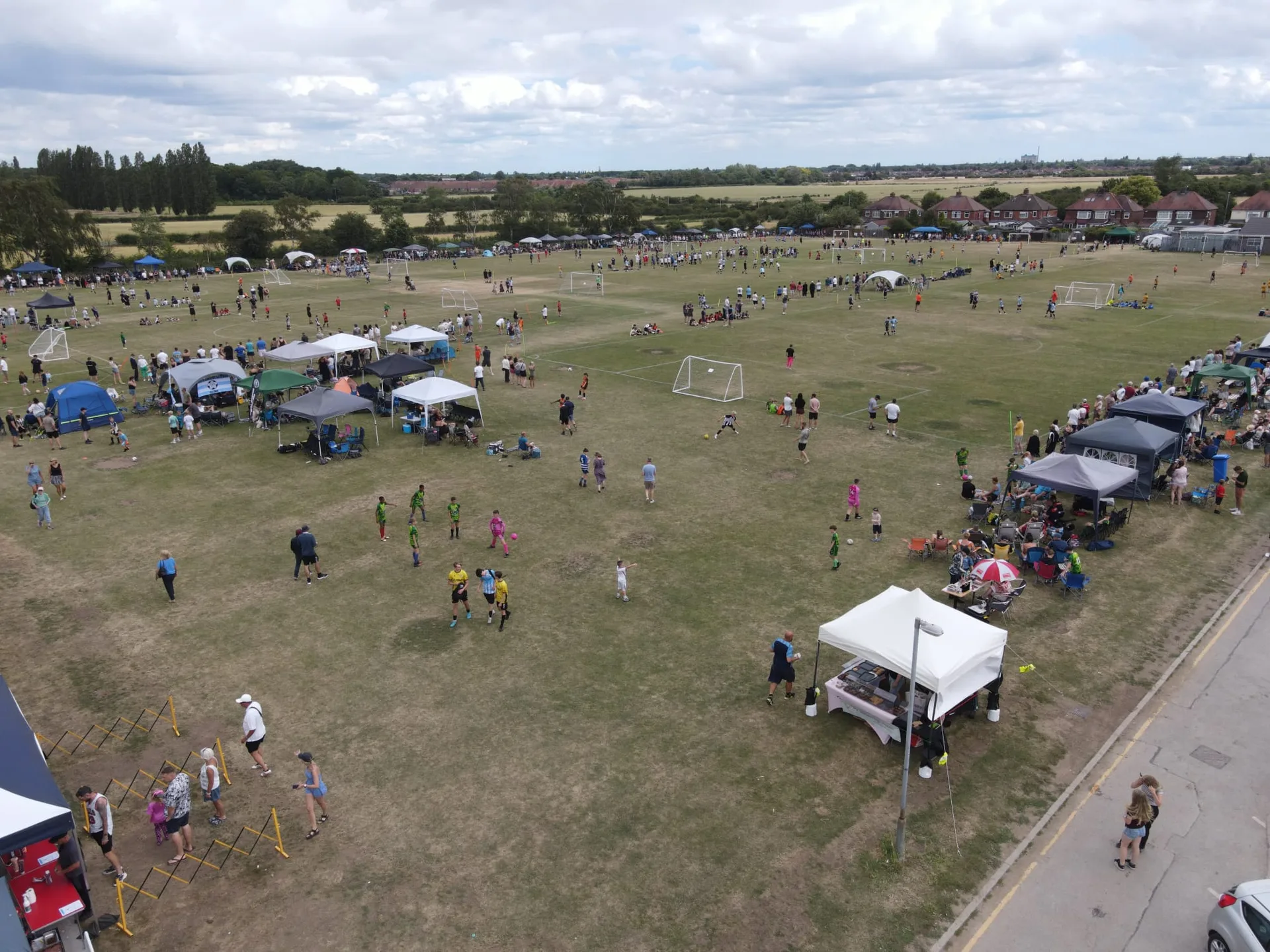 Bilsdon Park on tournament day, pitches full of teams, tents and supporters