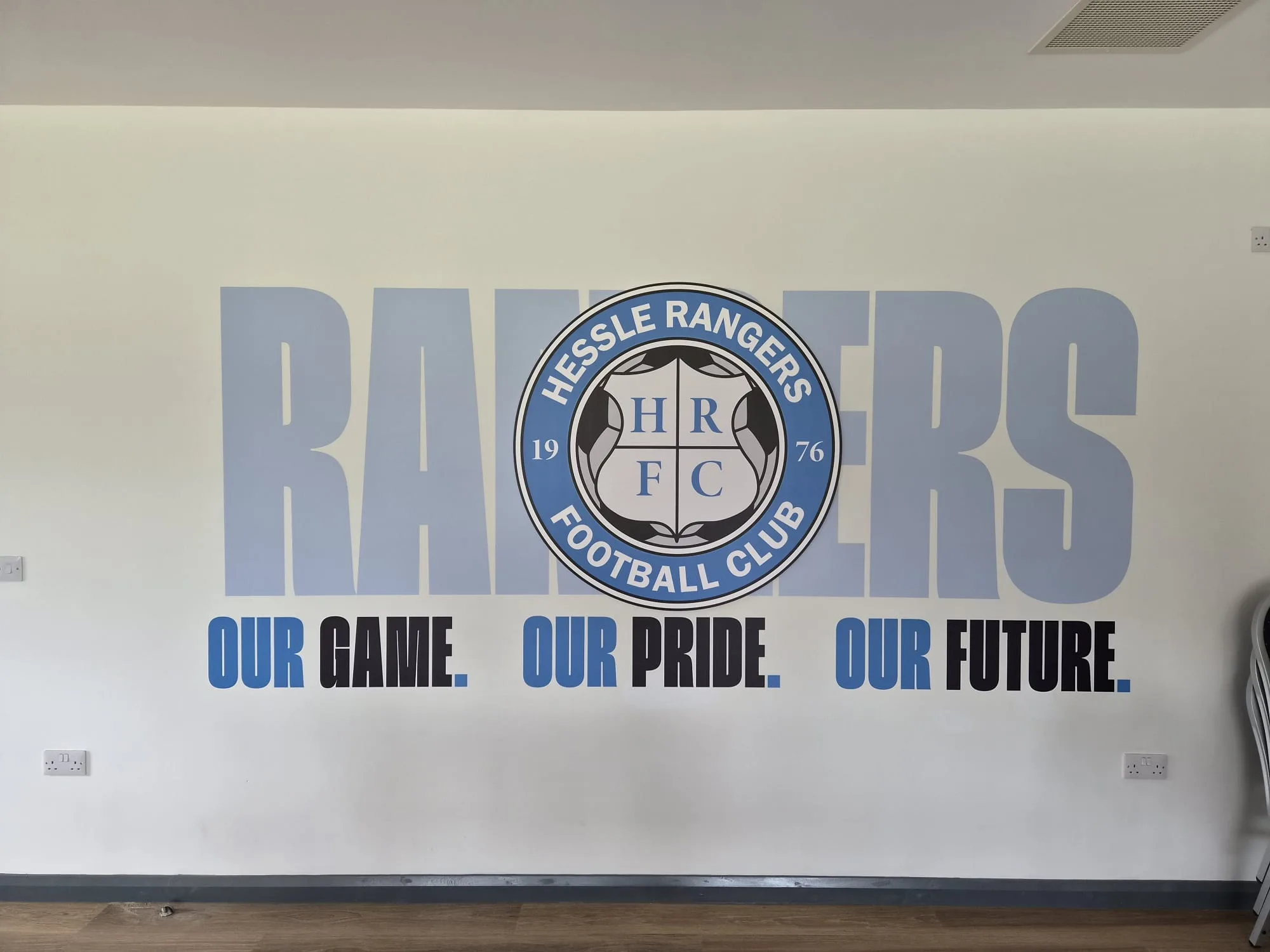 The clubhouse timeline wall and kitchen servery